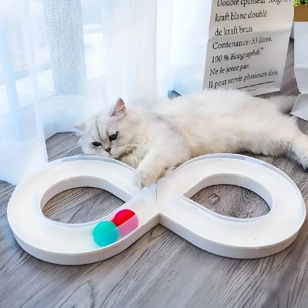 Blue and white cat turntable track ball toy with teasing stick on a flat surface.