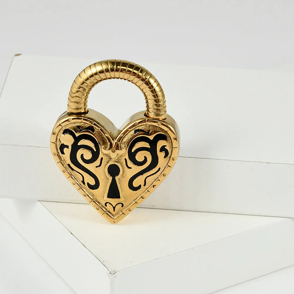 Close-up of a women's stainless steel heart-shaped earring with an electroplated gold colour finish.