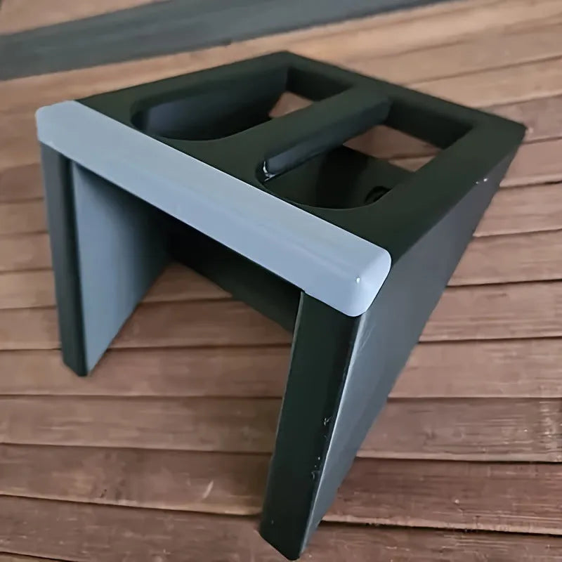 Black punk-style plastic pistol stand for toy gun display.