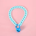 Adjustable plastic pet collar in macaron candy colours on a table, showing chain blue, pink, and mixed colour variants.