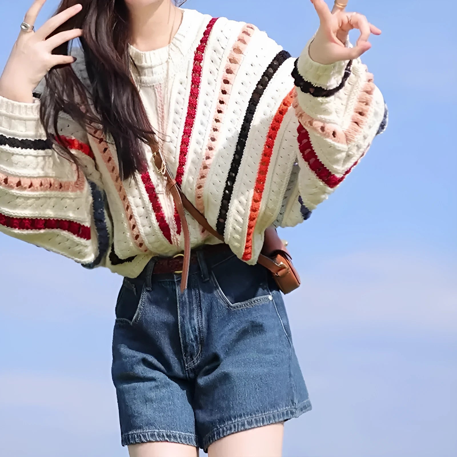 Rainbow striped batwing sleeve sweater with loose fit and round neck design