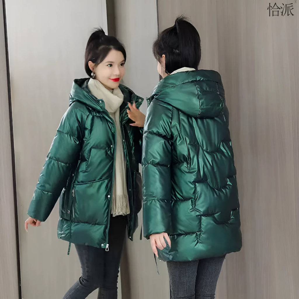 A loose-fitting, thick hooded winter jacket for women in a champagne colour, showcasing long sleeves.