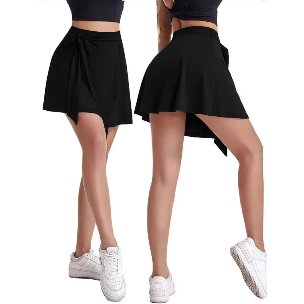 Black thigh-length anti-exposure sports skirt with high waist, built-in shorts, and shoulder strap details