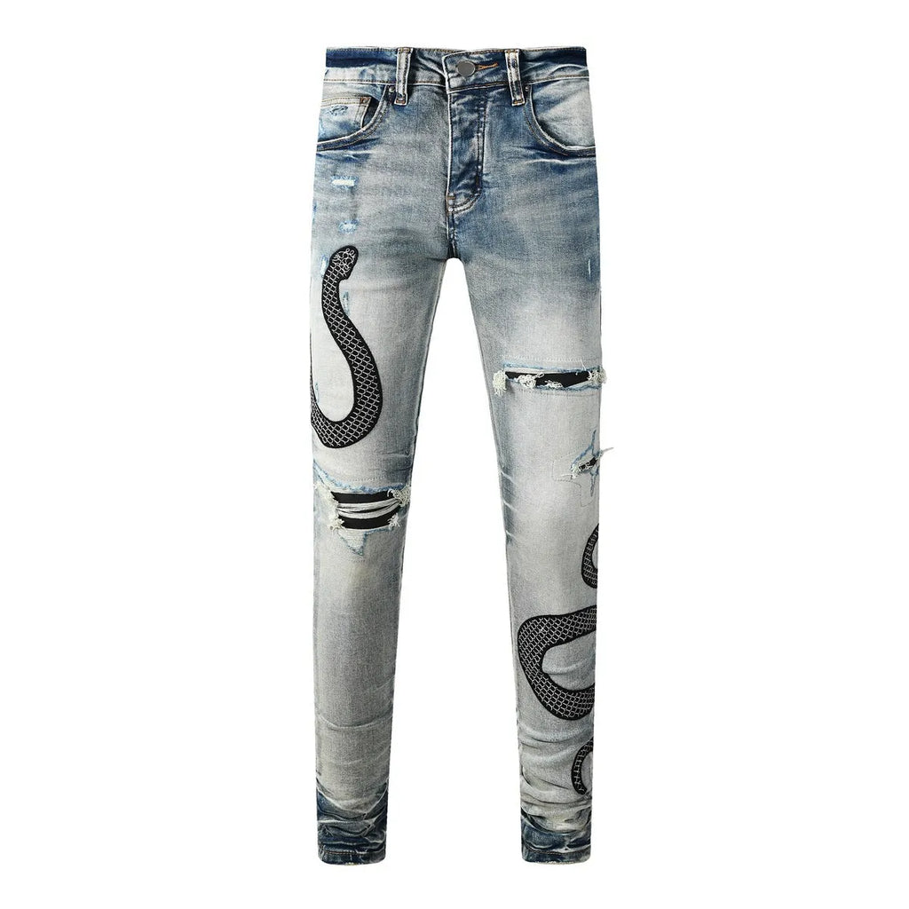 Blue distressed wash skinny jeans with a button fly and elasticated mid-rise waistband on a mannequin.