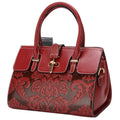 Red genuine leather women's crossbody bag with oval shape and embossed detailing.