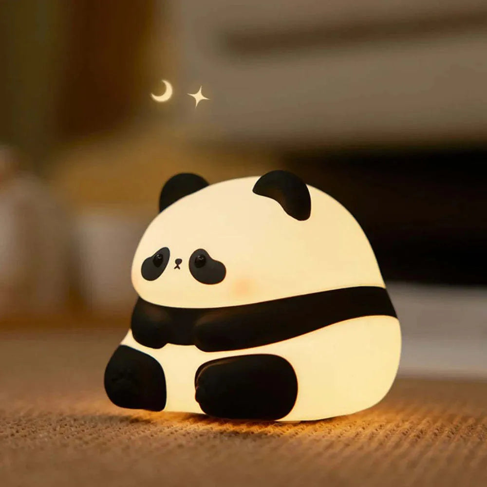 Cute panda-shaped night light made of BPA-free silicone on a bedside table