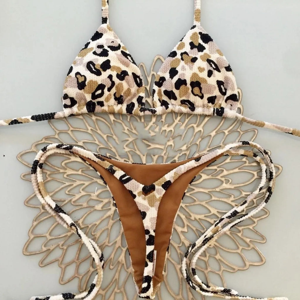 Women's printed bikini swimsuit set with quick-dry fabric on a mannequin, showing briefs style.