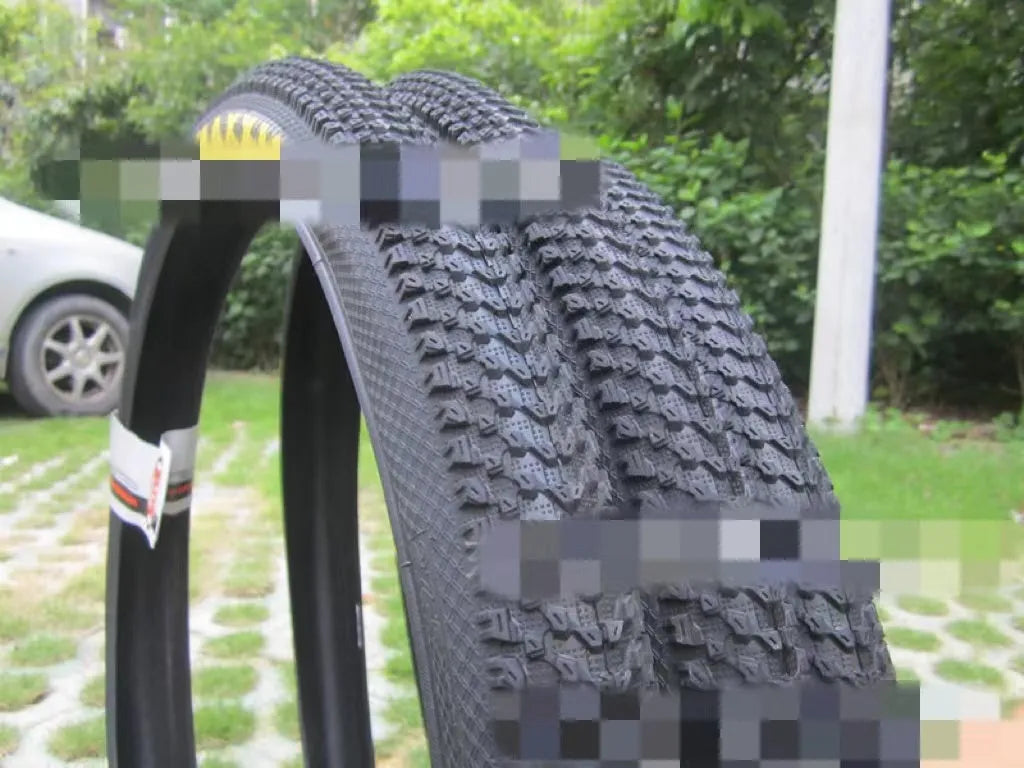 Mountain bike ultralight puncture proof tyre shown in black with white label sidewall option.