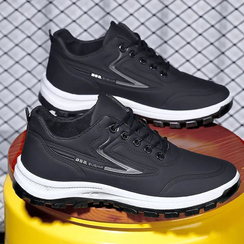 Waterproof leisure soft bottom sports work shoes in black and gray, low top, lace-up front, artificial PU upper