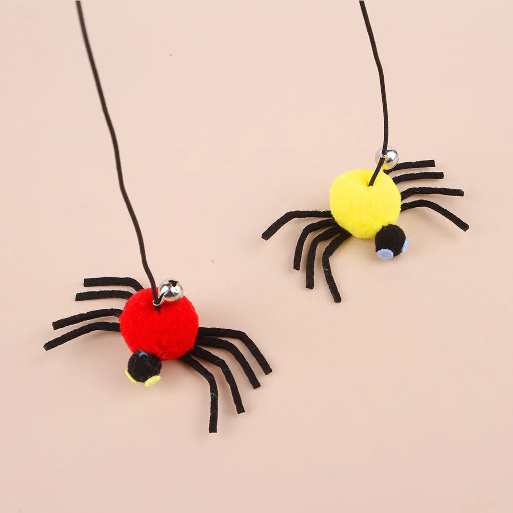 Red cat hanging toy with feather stick and bell spider on elastic rope mounted to door