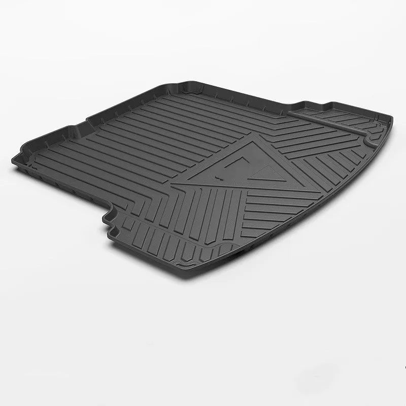 Black carbon fibre pattern TPE boot liner for a Special Car, showing textured surface and custom fit.