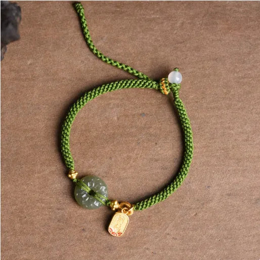 Hand-woven green rope bracelet with a Hetian jade safety buckle, adjustable sliding knot, women's National style accessory