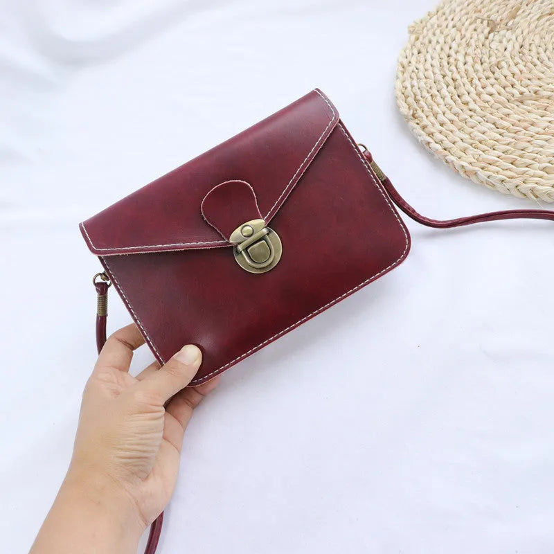 Retro fashion shoulder messenger bag with lock detail, cross square shape, in wine red colour