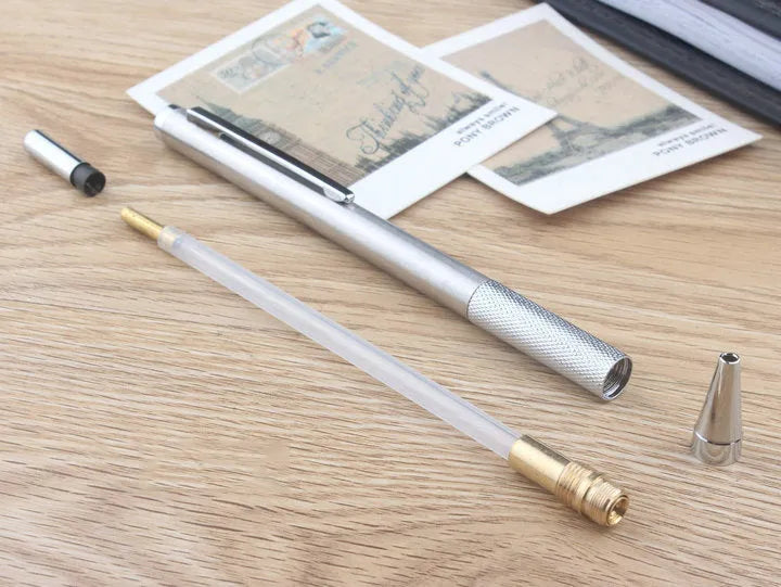 Silver metal automatic mechanical pencil with various lead size options shown.