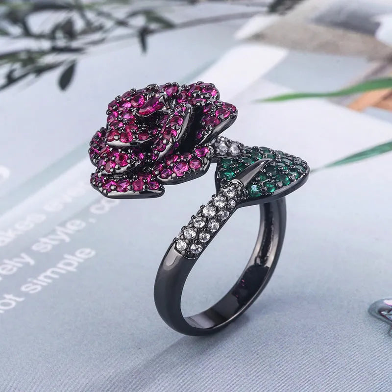 Black gold geometric flower ring with red simulation stones on gold-plated copper band