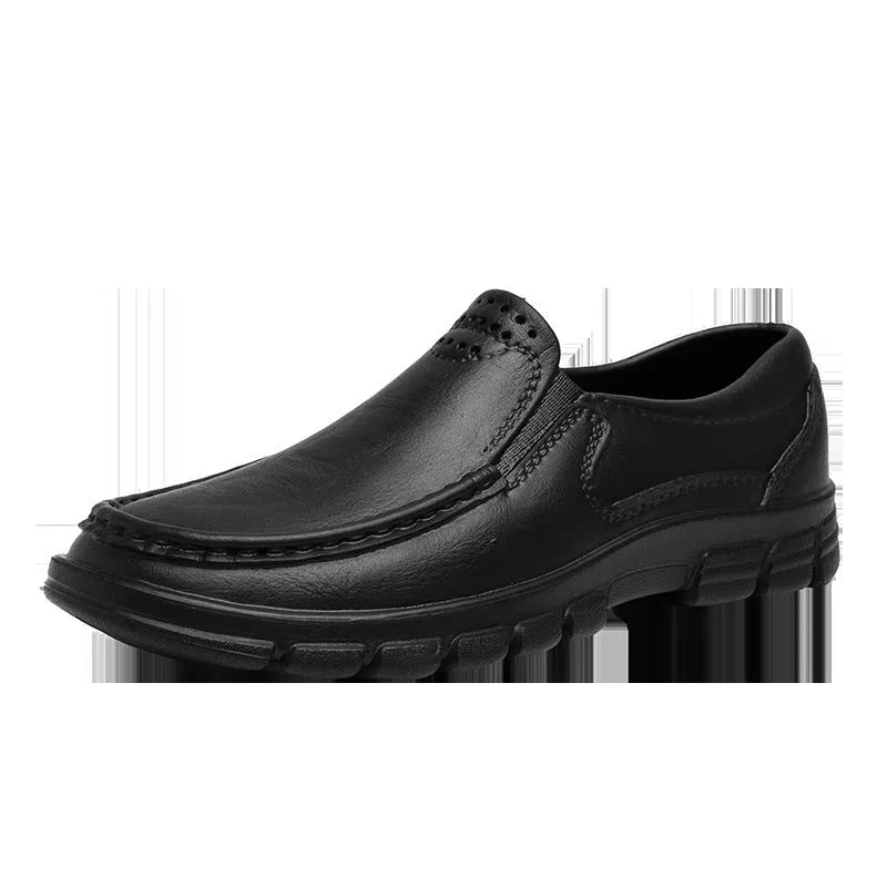 Men's slip-on work shoes in black with waterproof platform sole and mid heel, side view