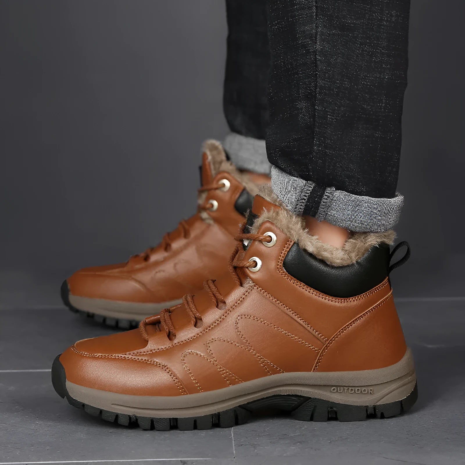 Men's black winter boots with plush lining, lace-up design, thick rubber sole, and round toe
