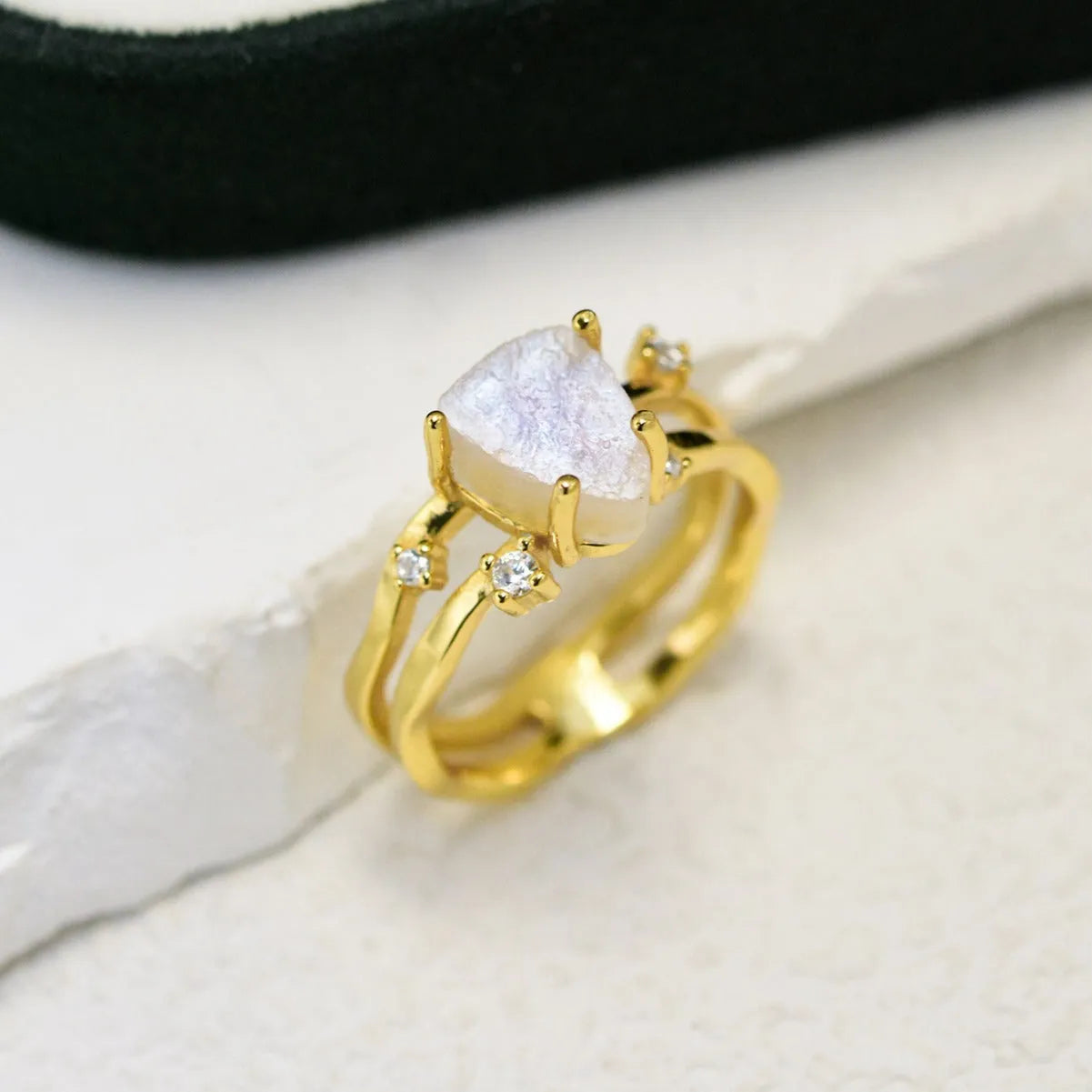 S925 silver ring with irregular triangle shape and moonstone in rose, white, or yellow gold finish.