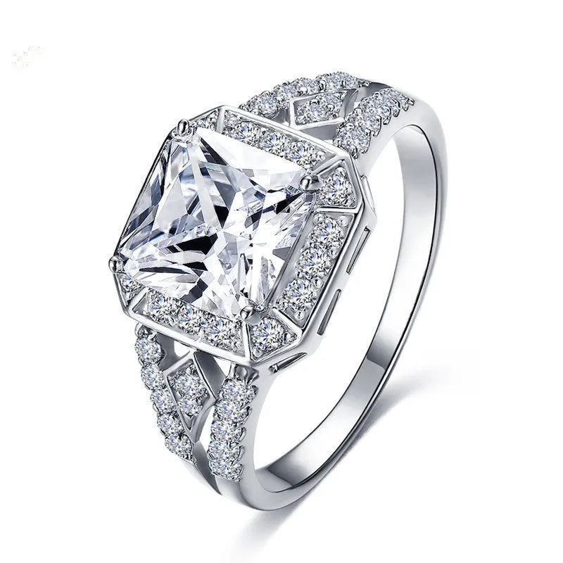 Geometric zircon ring with hollow quadrilateral design in platinum colour on copper band