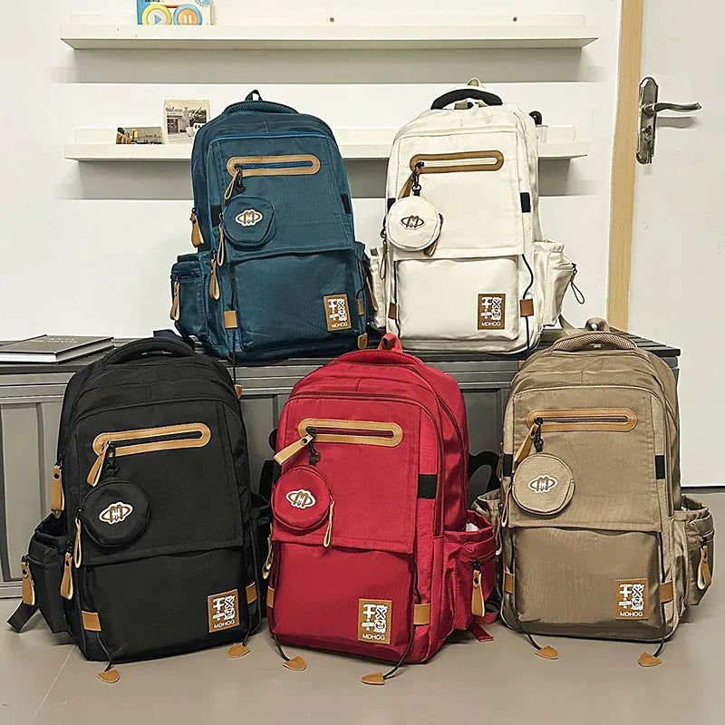 Japanese large capacity leisure travel backpack in black nylon with contrast stitching and waterproof finish