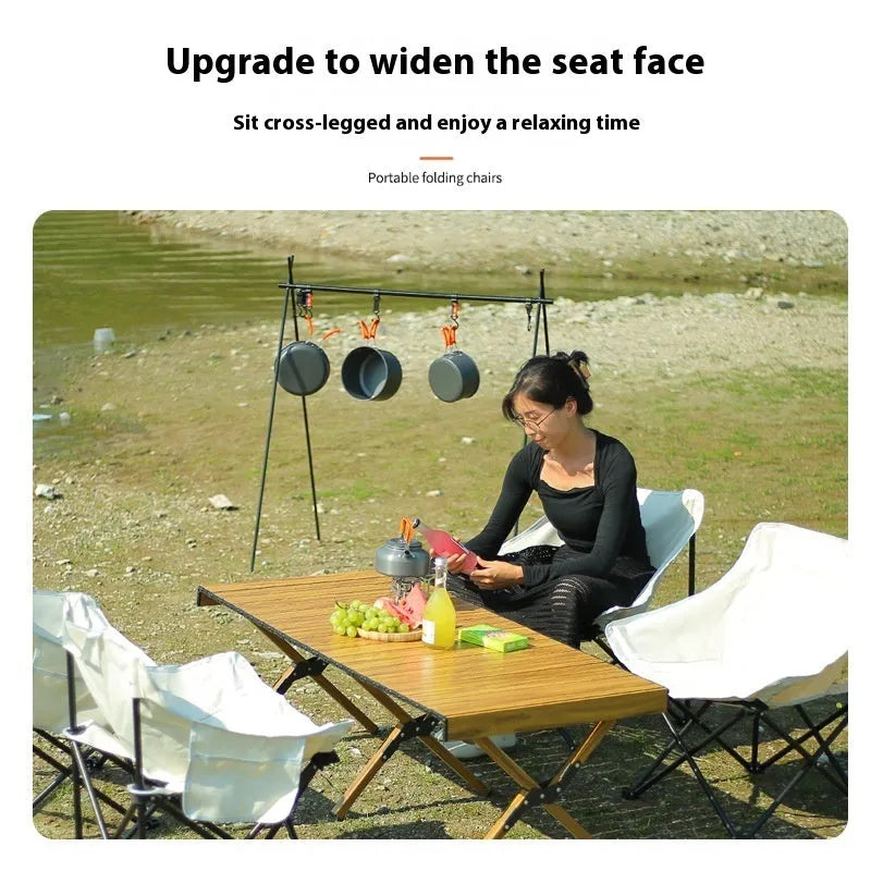 Camping outdoor folding chair in khaki with steel frame and 600D Oxford cloth, shown in a garden setting