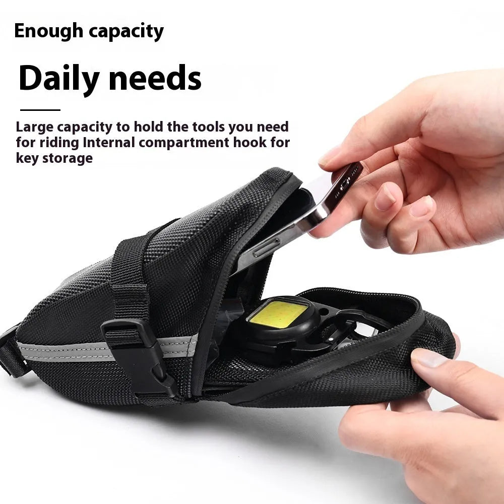 Black polyester quick-release mountain bike tail bag attached to a bicycle saddle, free size with padded interior