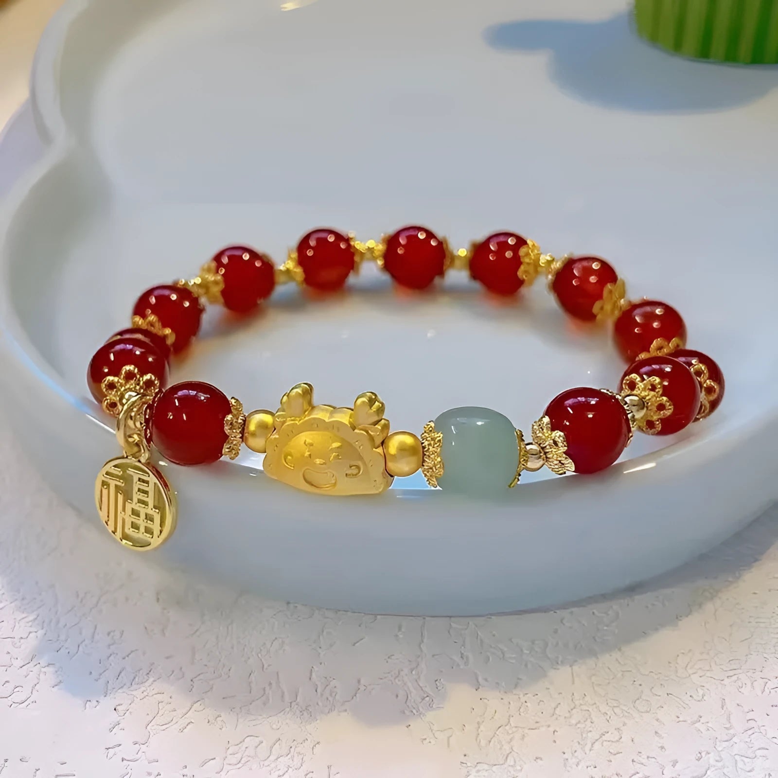 Women's glass floral glazed bracelet with ice crack effect and animal modelling in red or pink beads.