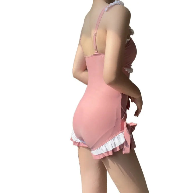 Women's one-piece milk silk swimsuit in solid pink colour with sleeveless design