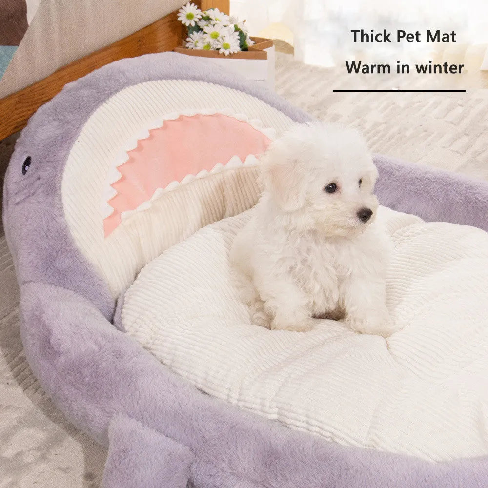 Blue shark pattern pet bed for dogs and cats with raised sides and non-slip base.