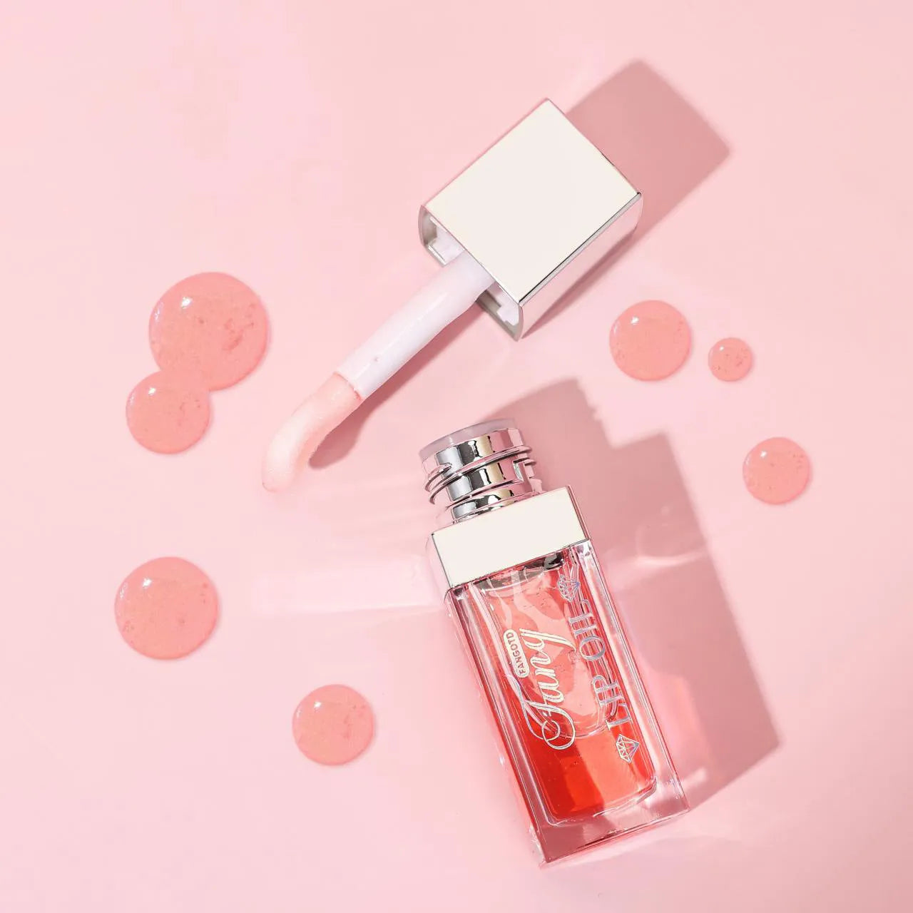 Five tubes of bright mint lip gloss lipstick in different shades on a white background.