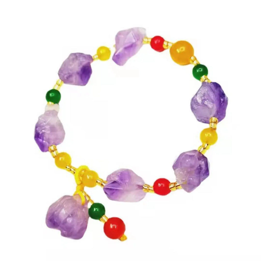 Close-up of a natural-shaped amethyst bead bracelet for women with a fu charm.