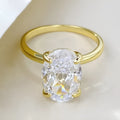 Oval solitaire ring in sterling silver with a four-prong setting and a central gemstone.