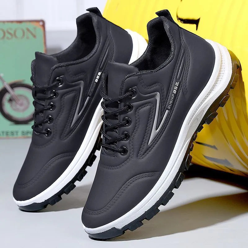 Waterproof leisure soft bottom sports work shoes in black and gray, low top, lace-up front, artificial PU upper