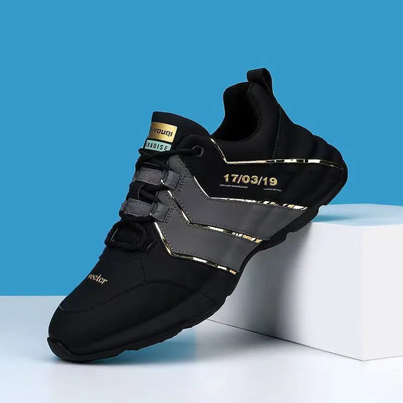 Casual low-top sneakers with round toe, lace-up front, and thick plastic sole in black and grey.