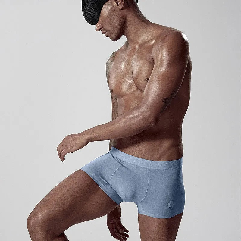 Men's seamless modal briefs in solid colour with mid waist design for body shaping