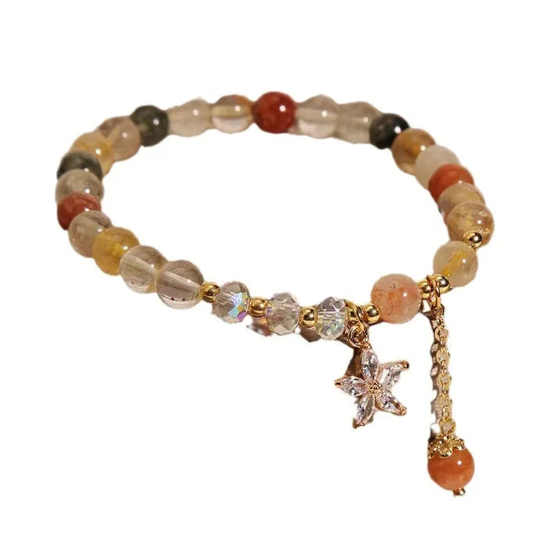 Single circle coloured hair crystal bracelet with zircon butterfly motif on light background