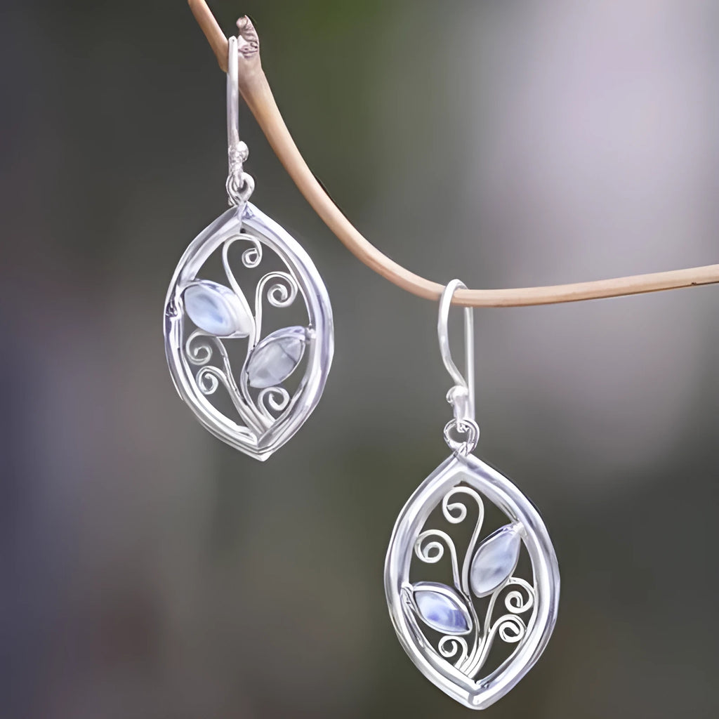 Silver alloy leaf-shaped earrings with embedded colourful moonstone gemstones and diamond-cut treatment