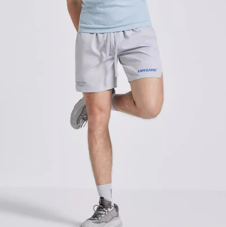 Men's fitness training shorts in four-point design, shown in available colours.