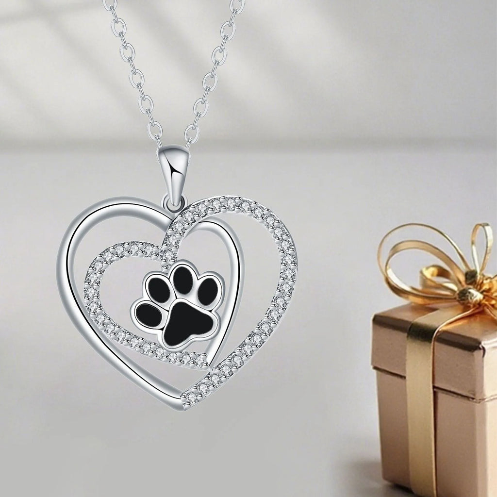 Original design women's necklace with copper dog paw print pendant on a cross chain.