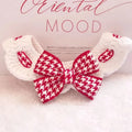 Black houndstooth wool knitted pet collar and neck warmer on white background, size M 30cm