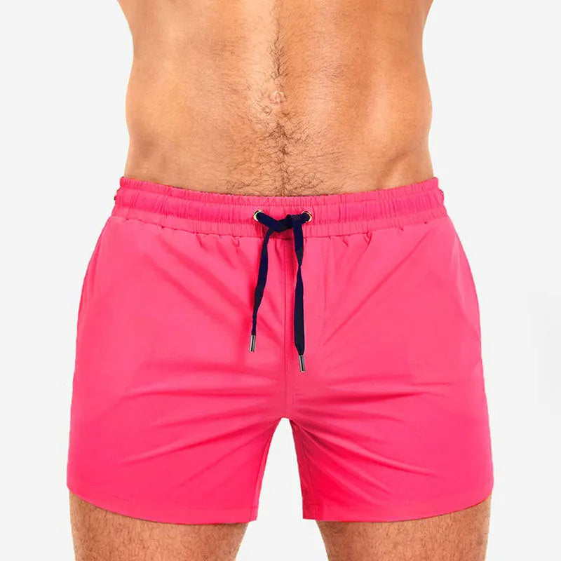 Polyester sports shorts with mesh lining in Army Green colour, laid flat.