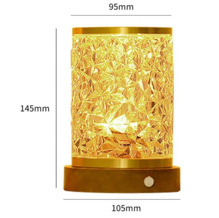 Small modern acrylic and wood water ripple night light with rotating base on a bedside table.