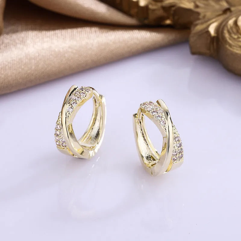 Geometric women's earrings with 14K yellow gold finish and zircon stone details on copper base