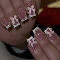 French manicure false nails with white bow design on short square nails with S274 adhesive glue