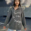 Light khaki women's alpaca wool pullover sweater with a diagonal front zipper and turtleneck.