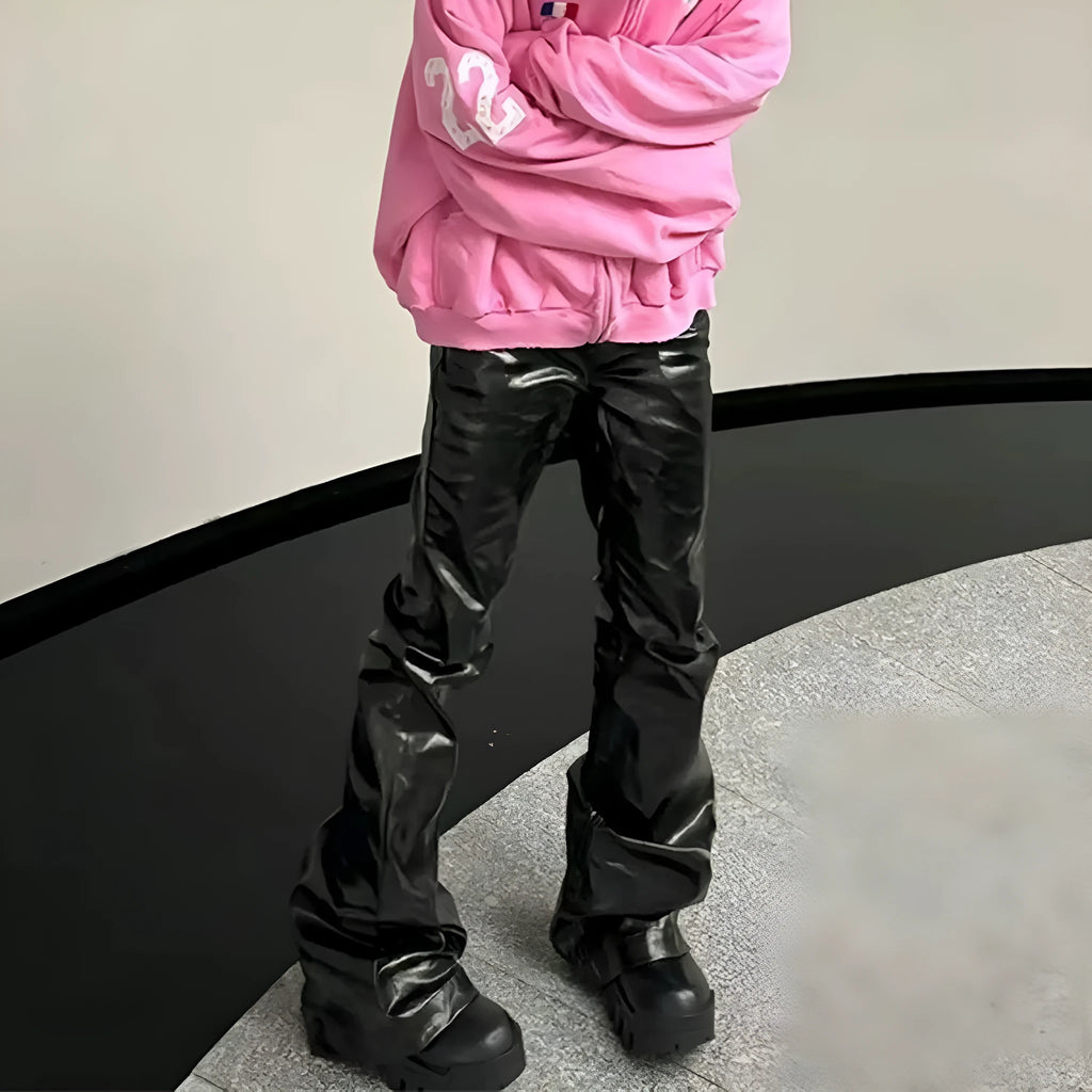 Black shiny patent leather straight-leg skinny jeans on a hanger