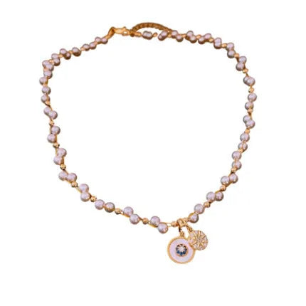 Gold electroplated necklace with round imitation pearl pendant and zircon accents on clavicle-length chain