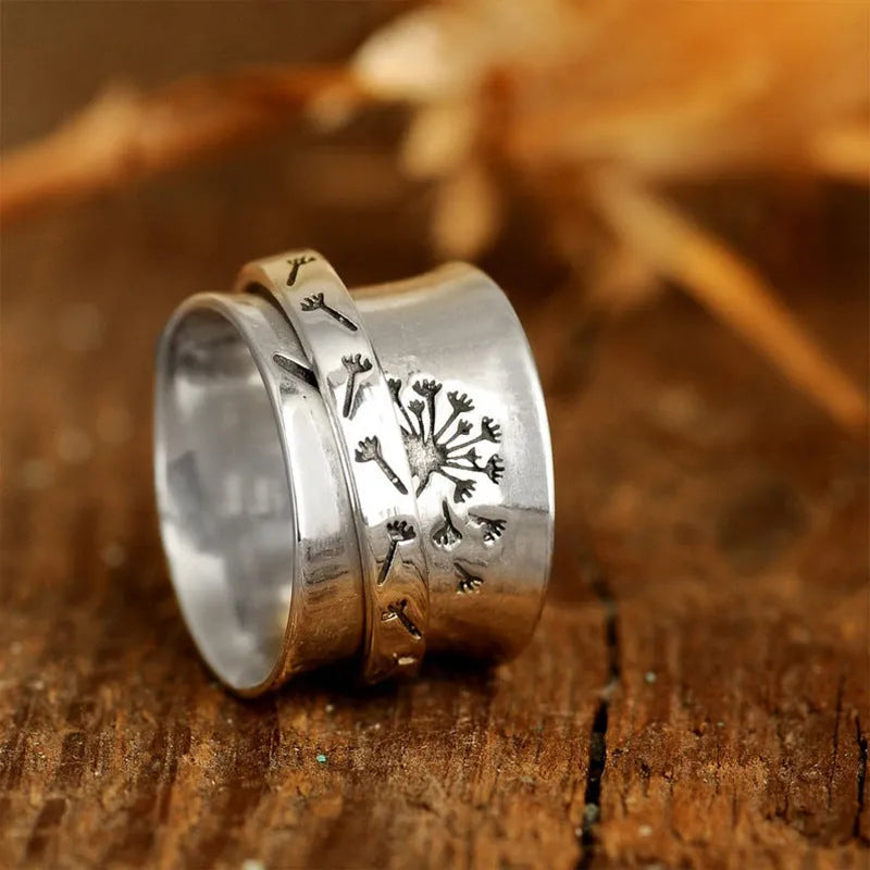 Silver electroplated alloy flower ring with rotatable design on finger