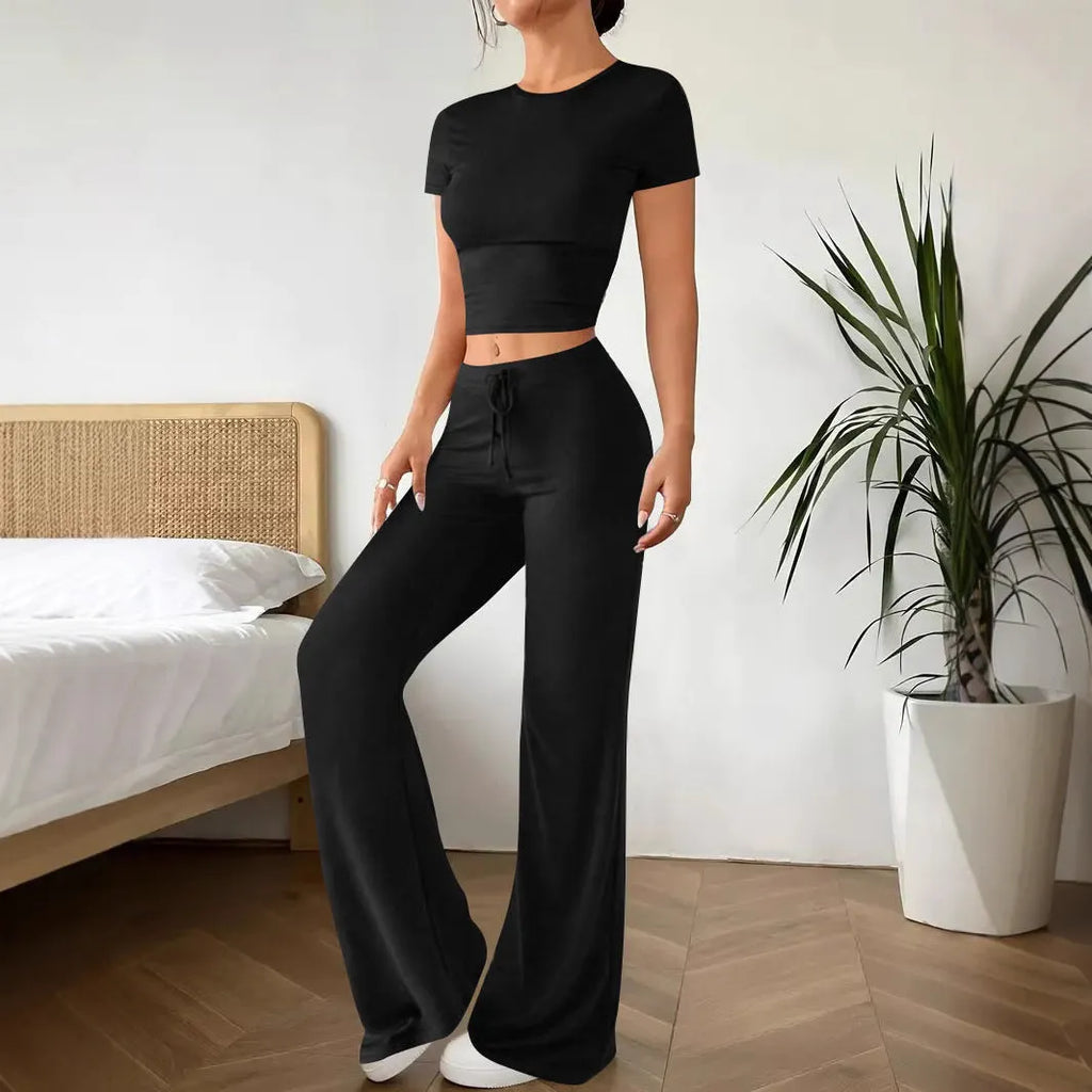 Women's black high-waist trouser and short-sleeve t-shirt suit set on hanger