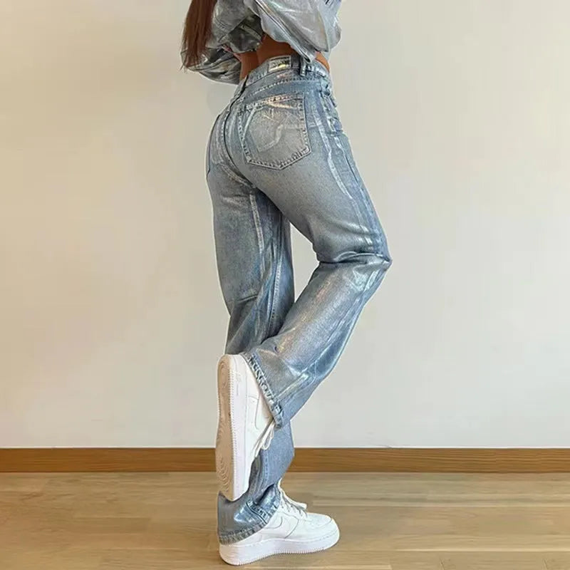 Women's high waist straight leg jeans in washed blue denim with hot silver contrast details